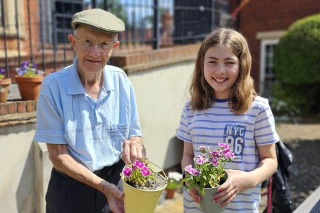 Resident Brian and Kiera enjoying the home gardens