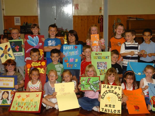 Corby: Beanfield Primary school retirement - Truda Taylor pictured with members of her class. 2008