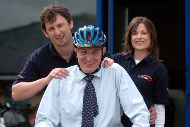 Peter Bone MP for Wellingborough (centre) with the owners of Cyclelife Darren Jeyes (left) and Avril Jeyes (right). May 2007