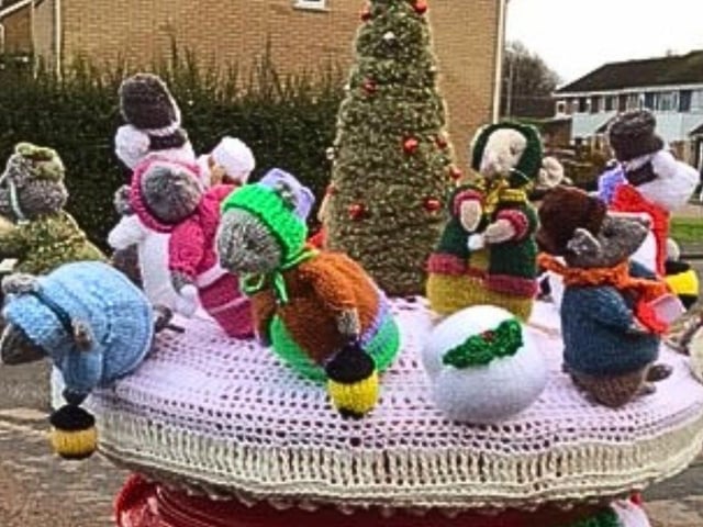 Rushden Yarn Bombers have decorated the town's post boxes with festive toppers