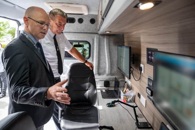 Northamptonshire Chief Constable Nick Adderley gets a guided tour of the new Digivan from Det Sgt Jason Cullum