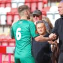 George Cooper greets his family after Kettering Town's Easter Monday draw at Kidderminster Harriers. Picture by Peter Short