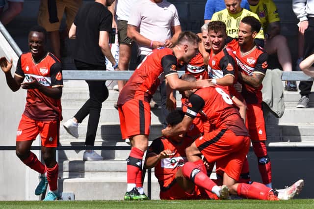 The Kettering Town players celebrate after Jordan Graham put them in front but they went on to lose 2-1 at AFC Fylde on the opening day of the season. Picture by Paul Cooke/Poppies Media