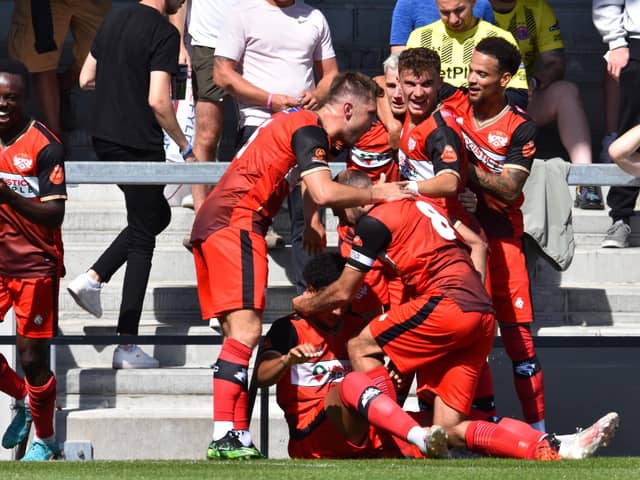 The Kettering Town players celebrate after Jordan Graham put them in front but they went on to lose 2-1 at AFC Fylde on the opening day of the season. Picture by Paul Cooke/Poppies Media
