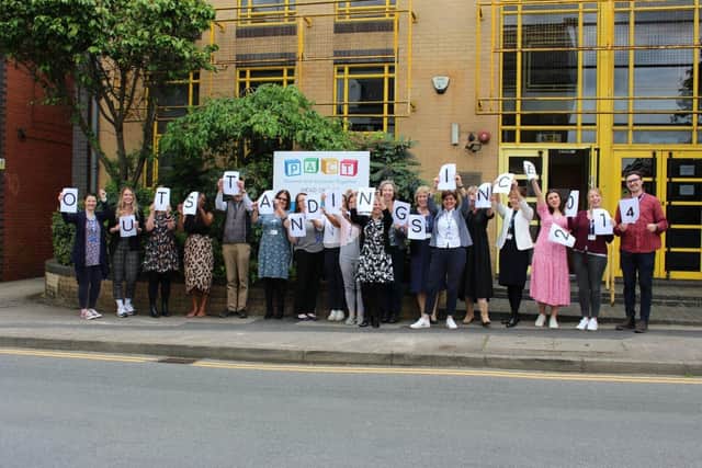 Staff at PACT's head office in Reading celebrate the adoption charity's outstanding rating from Ofsted