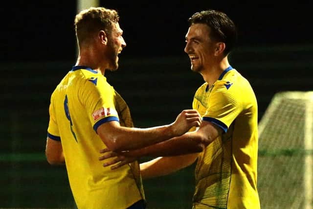 Ethan Johnston (right) is all smiles after firing Wellingborough Town into the lead at Rugby Borough (Picture: Rob Webb)