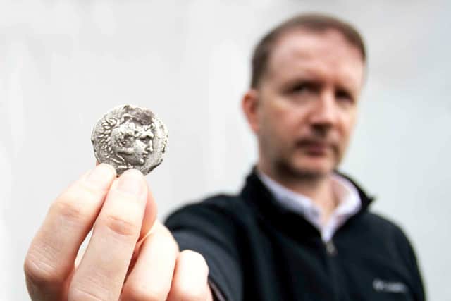 Mark Laban, from Hansons Auctioneers, with the coin.