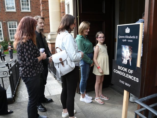 People queued to sign the book of condolence