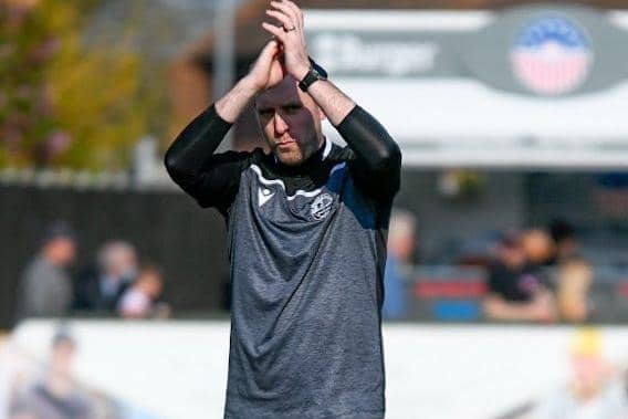 Andy Burgess applauds the AFC Rushden & Diamonds fans after the 2-1 success over Bromsgrove Sporting at Hayden Road. Picture courtesy of Hawkins Images