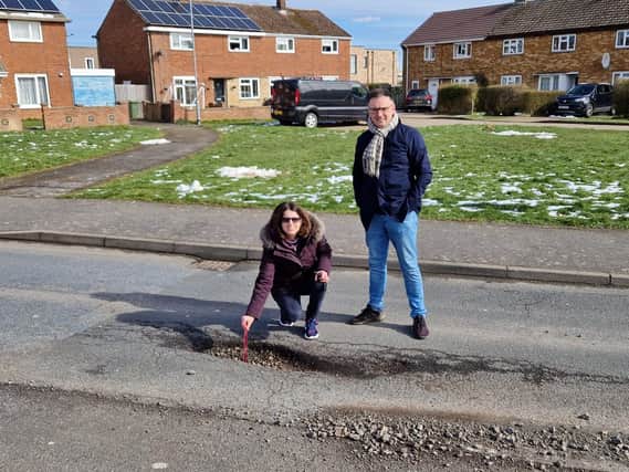 Cllrs Alison Dalziel and Simon Rielly have been out in Corby looking at some of the dreadful potholes around the town including this one in Fotheringhay Road
