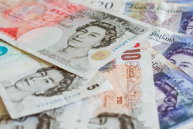 File photo of a pile of pound sterling notes