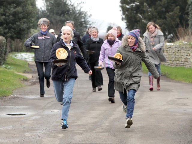 Caldecott annual pancake race along Church Lane - Pauline Graveson (left) and winner Anthea Hill
