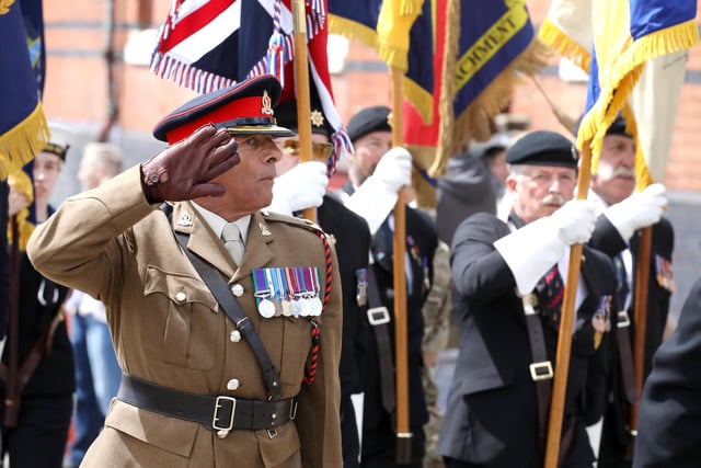 The salute taken by Brigadier David Russell-Parsons DL Rushden Armed Forces Day Parade  committee member Jake Baker