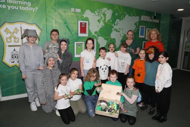 Some of the children representing endangered animals with Ellen White organiser
