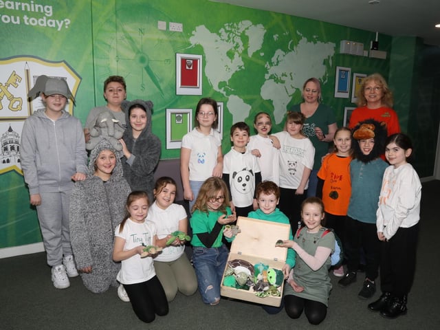 Some of the children representing endangered animals with Ellen White organiser
