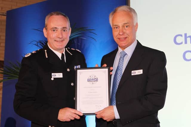 Dr Peter Gordon (right) receives the Chief Constable's Commendation Award from Chief Constable Adrian Lee (left) at the Northamptonshire Police Force Awards Ceremony.