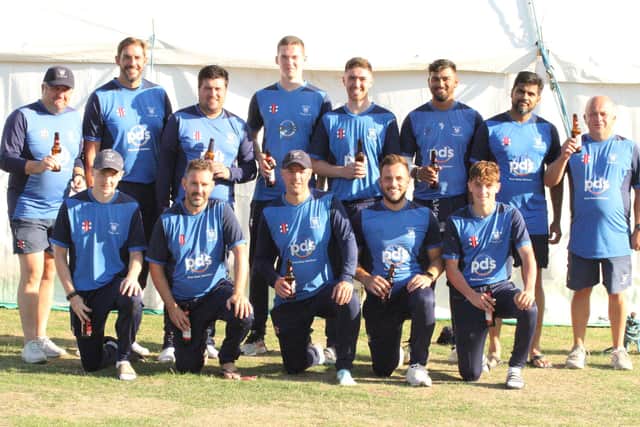 Wollaston's players celebrate their division one title win (Picture: Finbarr Carroll)