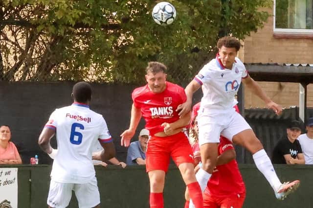 Diamonds defender Tejan Thomas heads clear against Coleshill (Picture: Shaun Frankham)