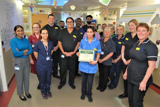 Alpa celebrates with the Paediatric Assessment Unit team.