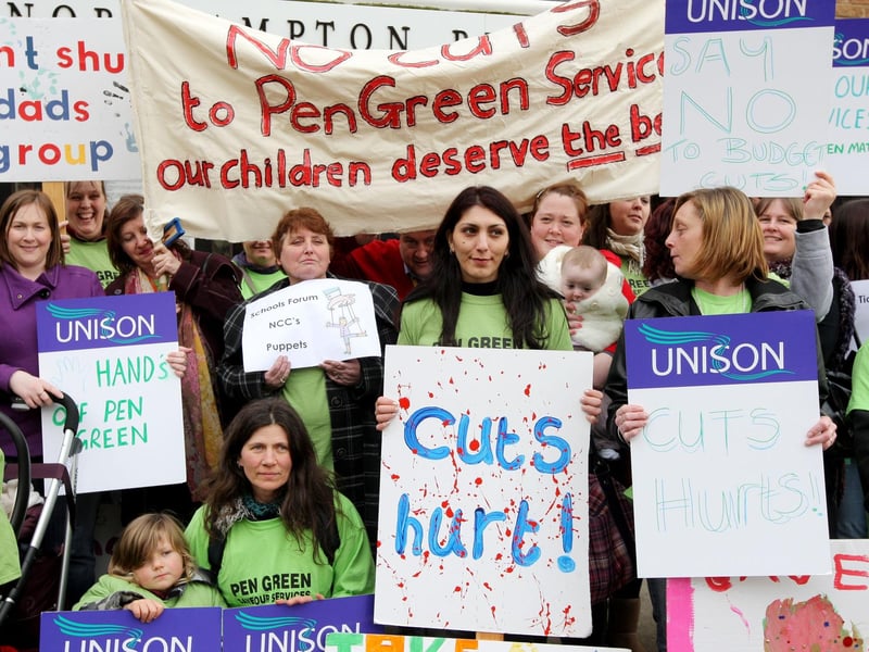 Pen Green protestors with banners protesting about cuts ahead of Schools Forum meeting.