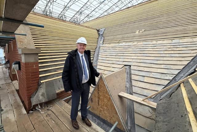 Cllr Martin Griffiths leader of NNC admires the roof work at Kettering Library /NNC
