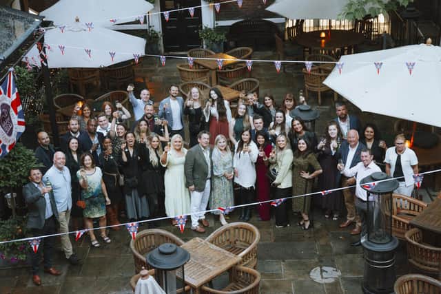 Guests join members of the EHA team to toast 25 years of success