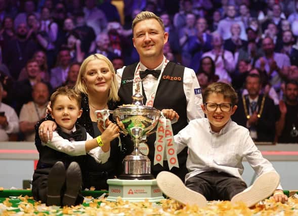 Kyren Wilson poses with his wife Sophie Lauren alongside his two young sons after winning the Cazoo World Snooker Championships