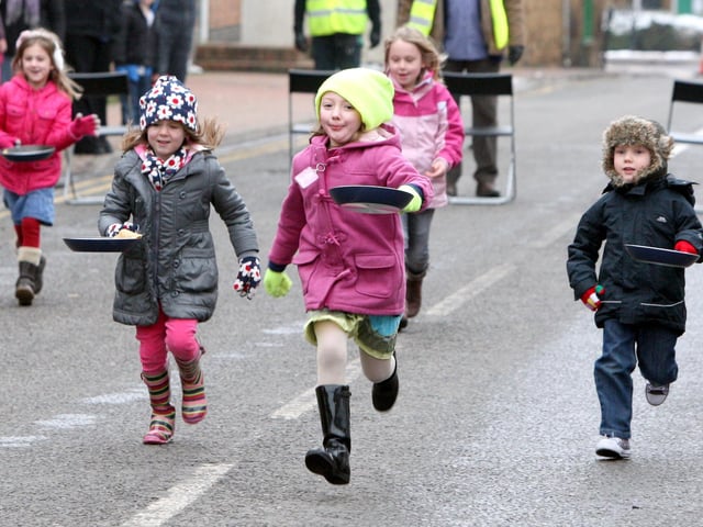 Desborough, Station Road pancake day races: Winners Kayleigh Cook, 6 and Tamara Fordham, 7, in. 2013