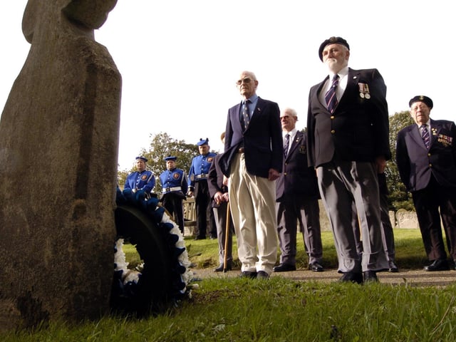 Weldon St Mary's Church Trafalgar Day parade: l-r Mike Dowling, (Weldon RBL), and Stan Barrett, (Corby RNA) stand in silence after laying their wreaths at Dr John Clark's grave.
October 2006