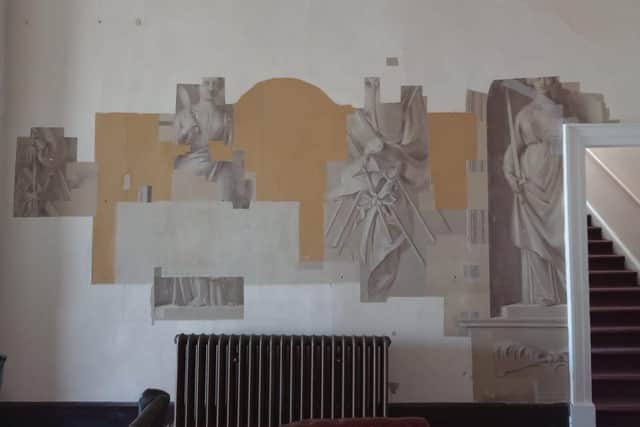 he East staircase landing is slowly be revealed by conservators at Stowe House.