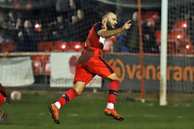 Gary Stohrer heads off to celebrate after he ended a 101-game wait for a goal by opening the scoring in Kettering Town's 2-0 win over Hereford. Picture by Peter Short
