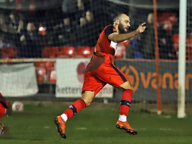 Gary Stohrer heads off to celebrate after he ended a 101-game wait for a goal by opening the scoring in Kettering Town's 2-0 win over Hereford. Picture by Peter Short