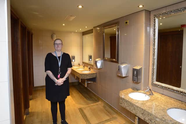Cross trained associate Hayley Kilsby in the toilets of The Railway Inn, Rushden