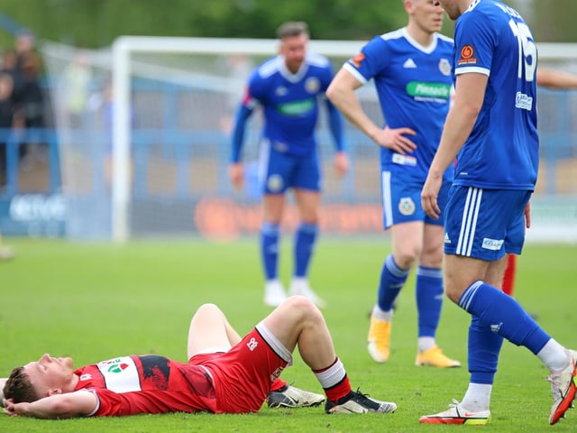 Jordon Crawford lies down on the turf after the final whistle