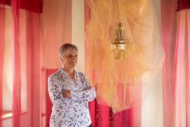Artist Marigold Short with one of the objects she has created for her ‘Testament’ Art Installation at Rushton Triangular Lodge. Credit: Rob Harris/English Heritage