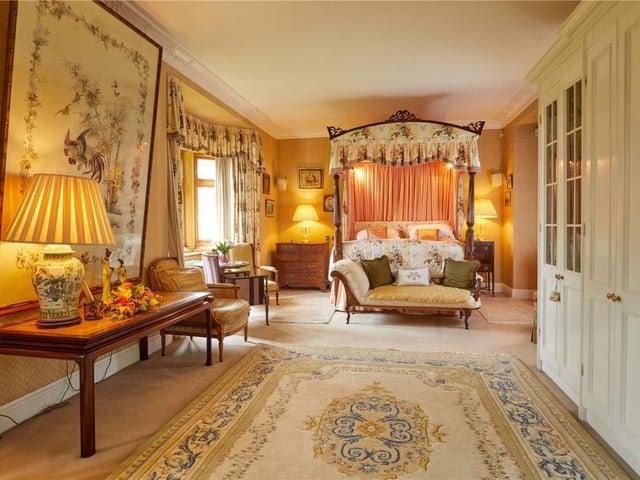 The home has traditional features as well as an indoor swimming pool, equestrian facilities and extensive parkland.