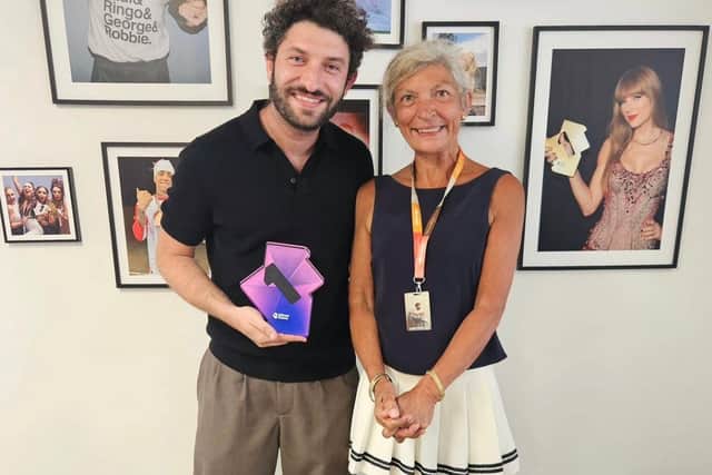 Billy Lockett pictured with his mother and chart award.