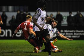 Curtis Burrows was sent-off for this challenge on former Corby Town man Joe Burgess in the derby defeat at Stamford. Pictures by Jim Darrah