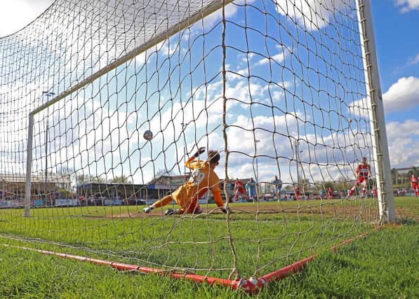 Callum Stead converts from the penalty spot to score Kettering Town's winner against Gloucester City. Pictures by Peter Short