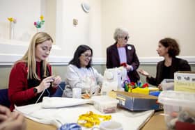 Gen Kitchen ( left) at the craft club with members and Anneliese Dodds MP (right)