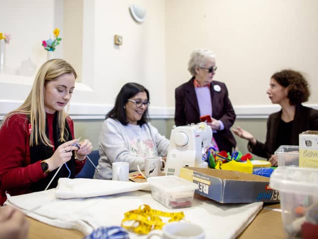 Gen Kitchen ( left) at the craft club with members and Anneliese Dodds MP (right)