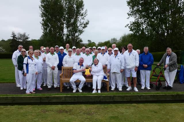 Club chairman Steve Speed and club president Maureen Young with the defibrillator along with members from Ise BC and Rothwell Manor BC.