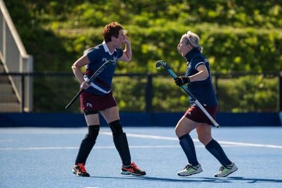 Mandy Starsmore-Young celebrates one of her three goals with Helen Keyworth