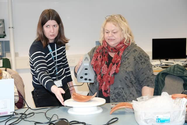 Olwen Mayes Chair of Higham Ferrers Archaeology Society seen here with Doctor Rachel Armitage took along pieces of Roman Samian ware that had been found in the town as well as the replica bowl she had commissioned. Using state- of- the -art equipment, Dr Armitage, the technical services manager at the School of Archaeology and Ancient History was able to provide her with 3D images