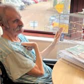 Pytchley Court resident Robert Hasker with 'Fred' the budgie