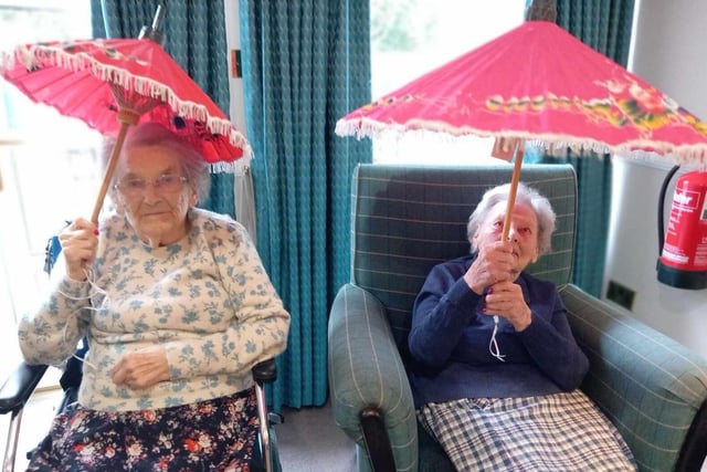 Happy Chinese New Year: Two residents holding their parasols.
