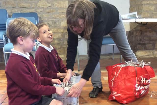 Jack, left and George get a lesson on how to make a hedgehog nest from Jackie Bestwick
