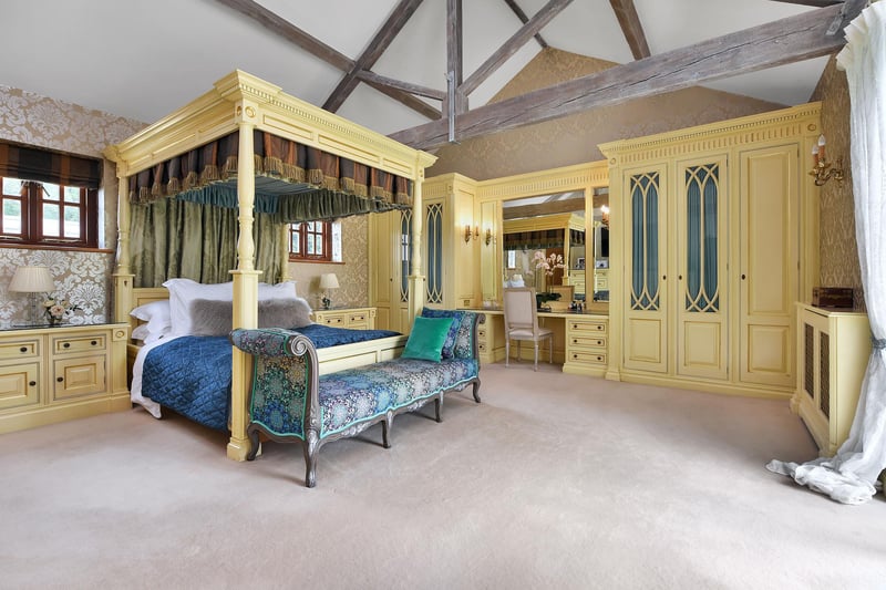 This four poster matches the splendour of the built-in furniture