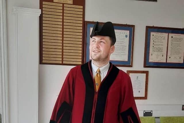 Kyle wearing ceremonial robes at Abergavenny Town Hall