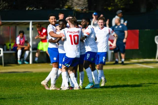 Connor Furlong is mobbed by his AFC Rushden & Diamonds team-mates after scoring the second goal in their 2-1 win over Bromsgrove Sporting. Picture courtesy of Hawkins Images